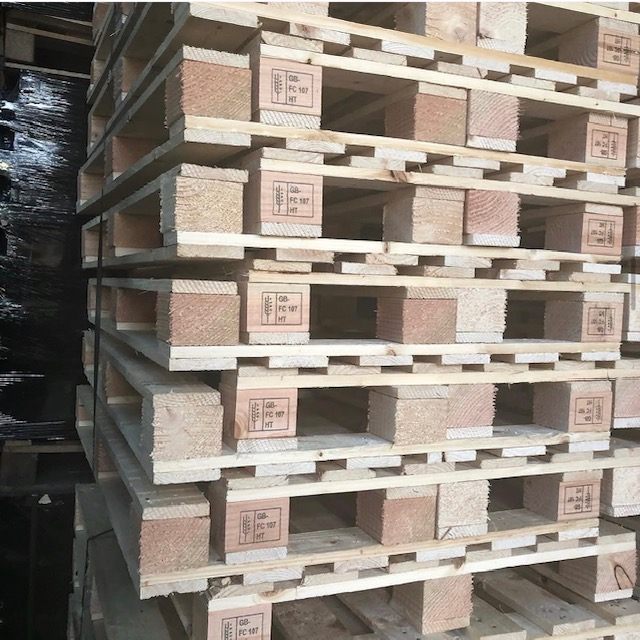 Wooden block pallets showing GB FC107 HT markings