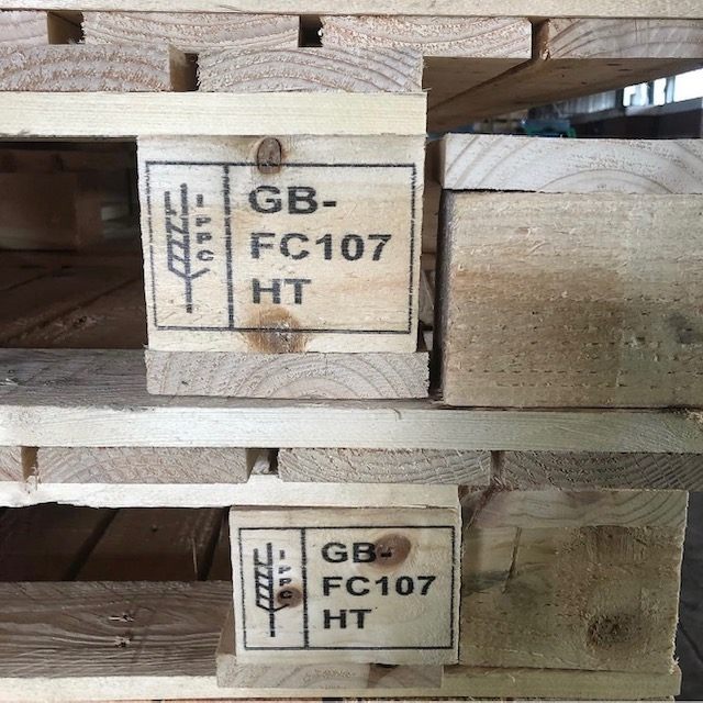 Two wooden pallet blocks bearing IPPC GB FC107 HT marks